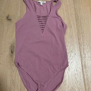 magenta tank top body suit in the color magenta size xs